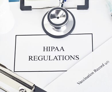 HIPAA regulations manual with facsimile patient documentation.